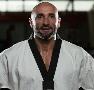 portrait physically fit mature man kimono with black belt (2)