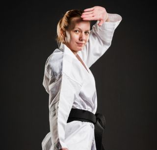 caucasian karate woman posing medium shot (1)