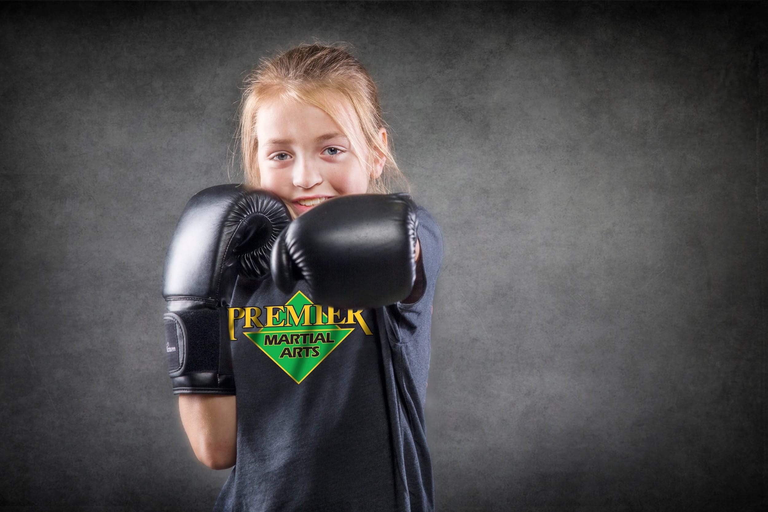 Girl in boxing gloves at Premier martial arts
